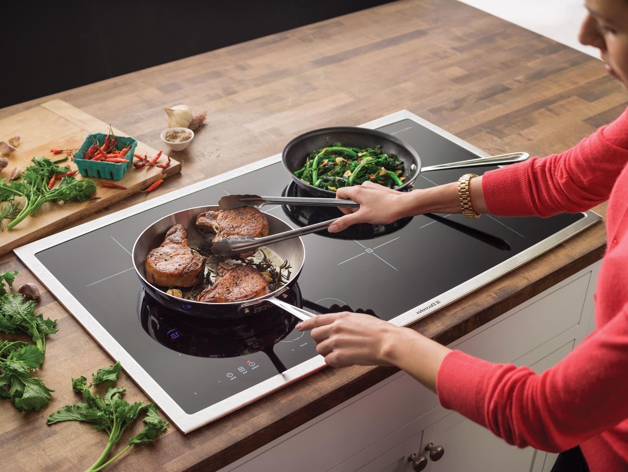 Lindsey cooking a delicious steak in her branded new induction cooktop.